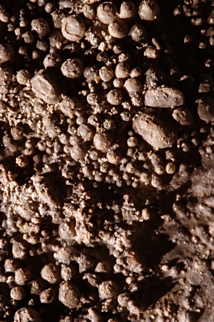 high-contrast image of cave pearls lit by a single hard light source